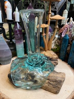 Molten glass vase on wooden base